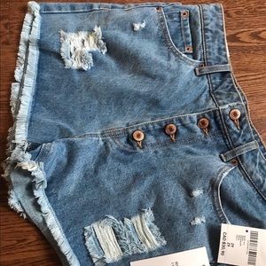 Denim high waisted buttons up shorts fits size M